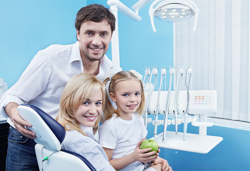 Happy family inside the dental